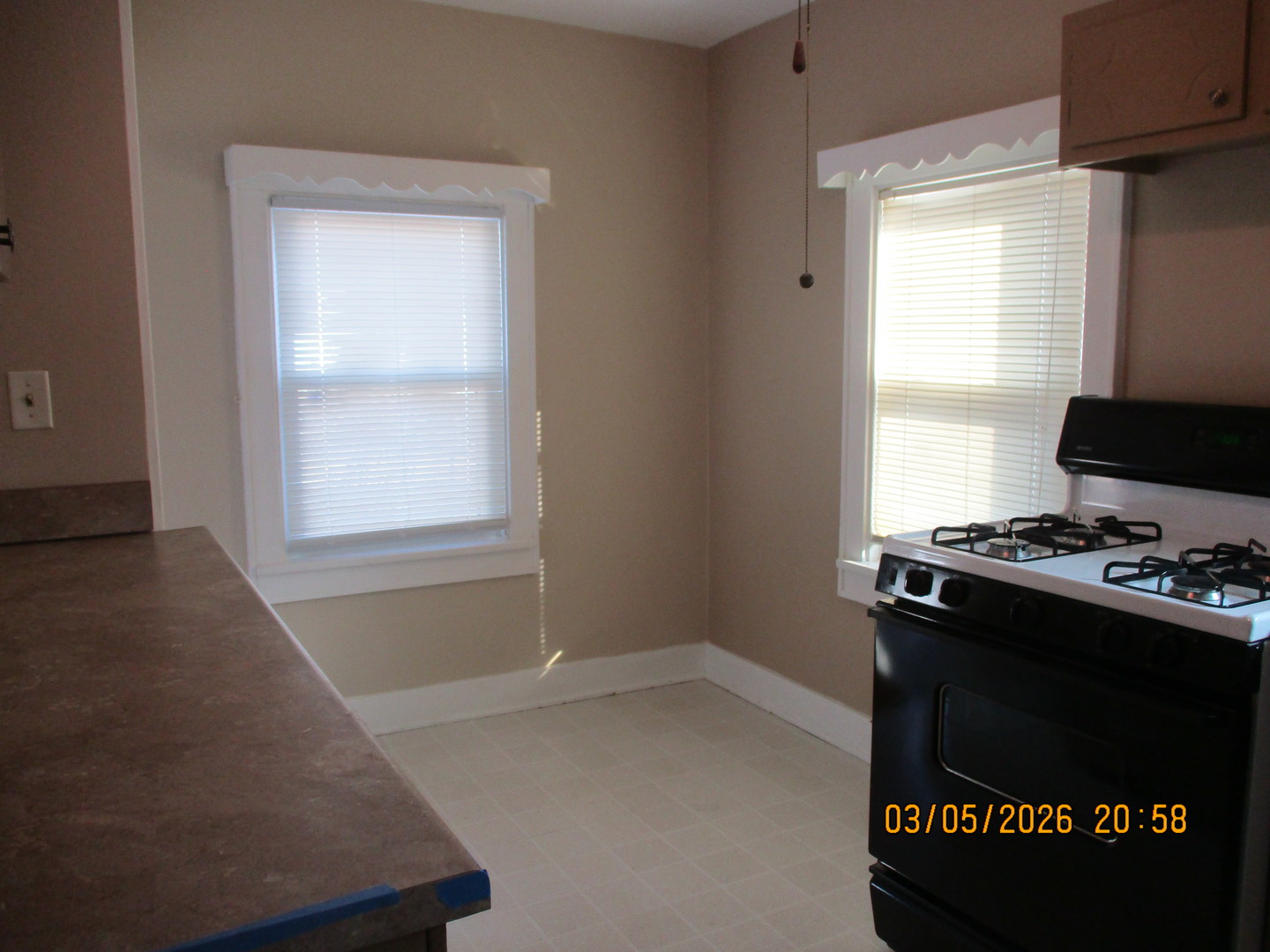 1412 13th Street Moline, IL 61265 - Photo 8 of 31 a kitchen with granite countertop a stove and a window