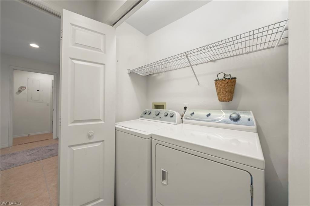 780 Waterford Drive, Unit 302 Naples, FL 34113 - Photo 19 of 47 a utility room with dryer and washer