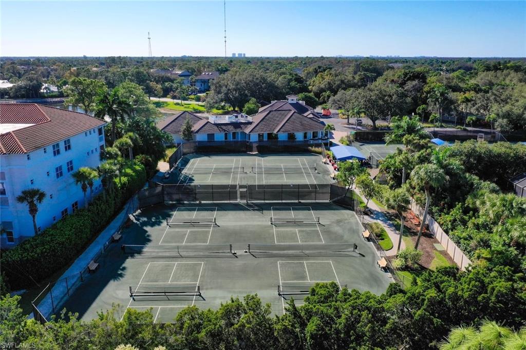 780 Waterford Drive, Unit 302 Naples, FL 34113 - Photo 44 of 47 an aerial view of a house with a garden