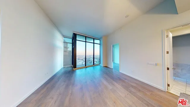 a bathroom with a mirror and a shower