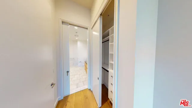a bathroom with a glass shower door