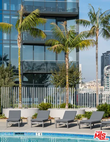a view of kitchen with stainless steel appliances a refrigerator and a stove
