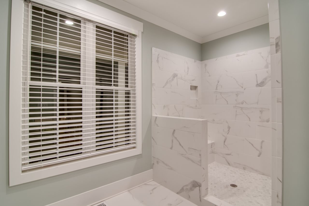 1006 Onslow Street Durham, NC 27705 - Photo 16 of 30 a view of a bathroom with a shower