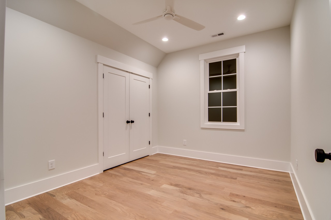 1006 Onslow Street Durham, NC 27705 - Photo 23 of 30 an empty room with wooden floor and windows