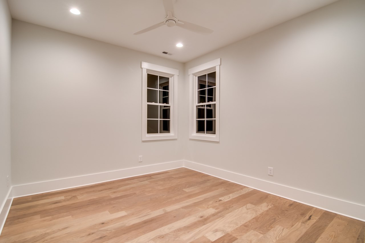 1006 Onslow Street Durham, NC 27705 - Photo 25 of 30 a view of empty room with wooden floor and fan