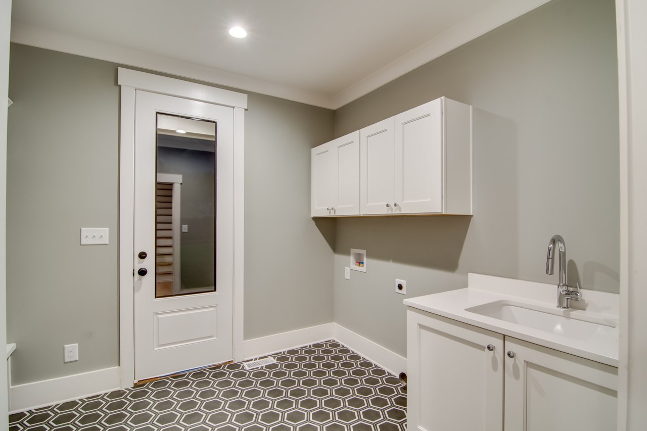 1006 Onslow Street Durham, NC 27705 - Photo 26 of 30 a kitchen with a sink and cabinets