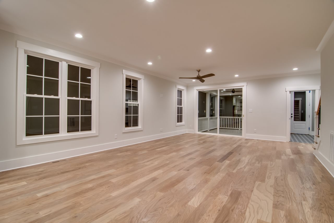 1006 Onslow Street Durham, NC 27705 - Photo 7 of 30 a view of an empty room with a window and wooden floor