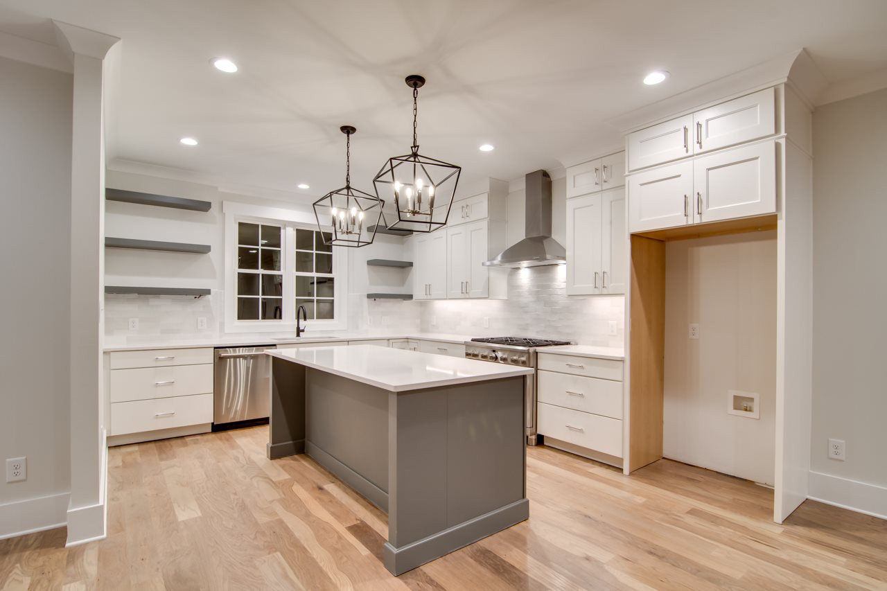 1006 Onslow Street Durham, NC 27705 - Photo 8 of 30 a kitchen with stainless steel appliances granite countertop a sink a stove and a refrigerator