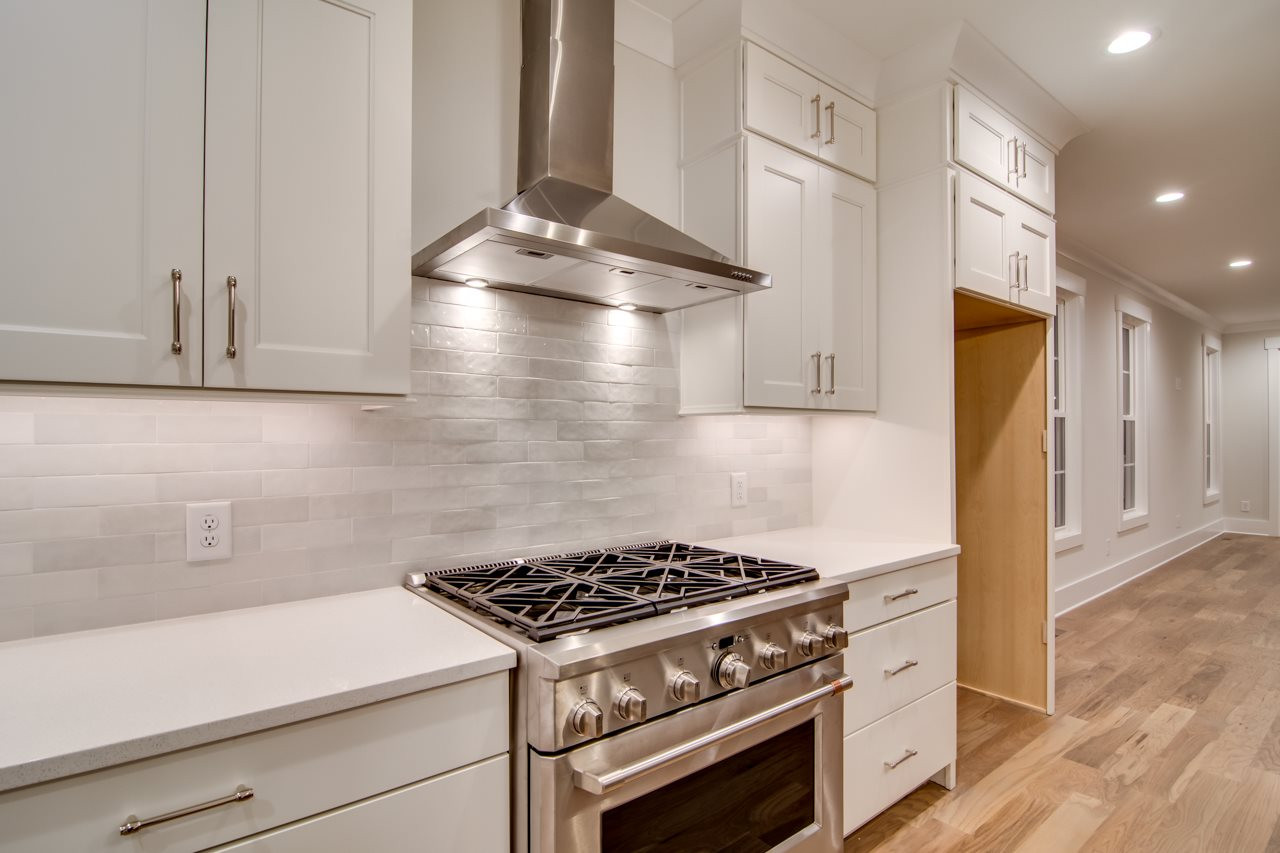1006 Onslow Street Durham, NC 27705 - Photo 10 of 30 a stove top oven sitting inside of a kitchen