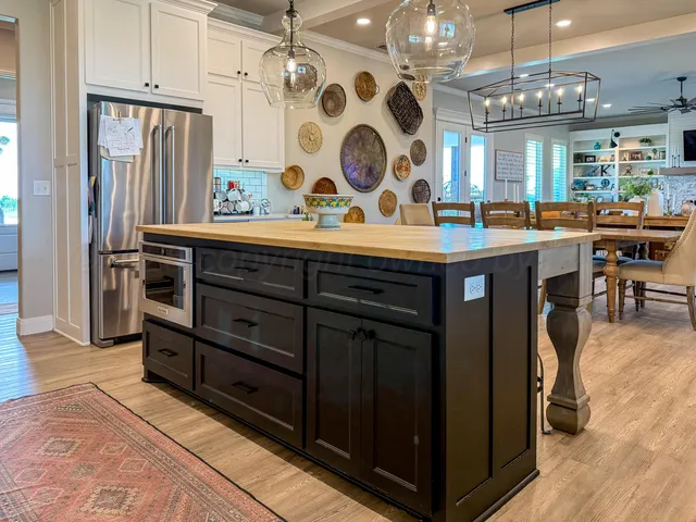 a view of hall way with furniture and chandelier