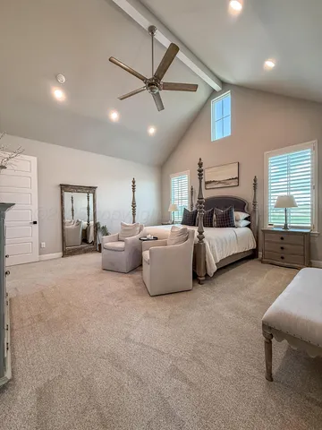 a living room with furniture and ceiling fan