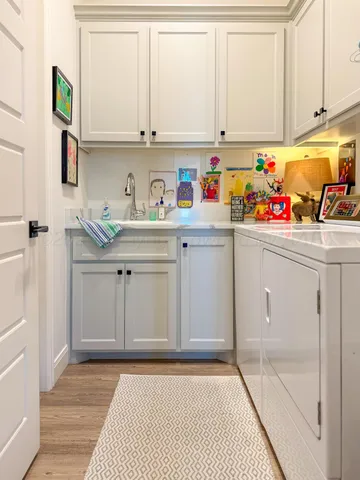 a view of cabinets with wooden floor
