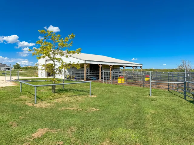 a view of a house with a big yard