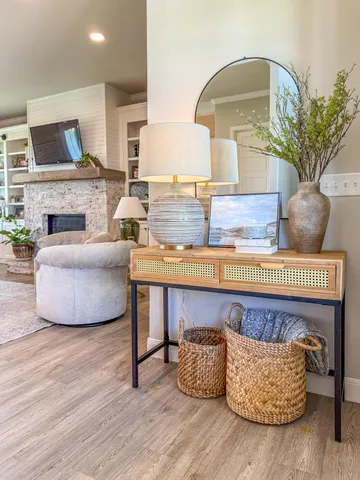 a living room with furniture and a fireplace
