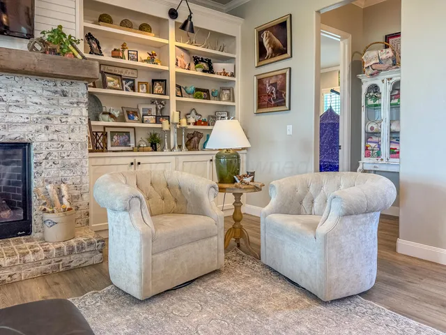a living room with furniture and a bed