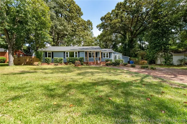 a view of a house with a big yard