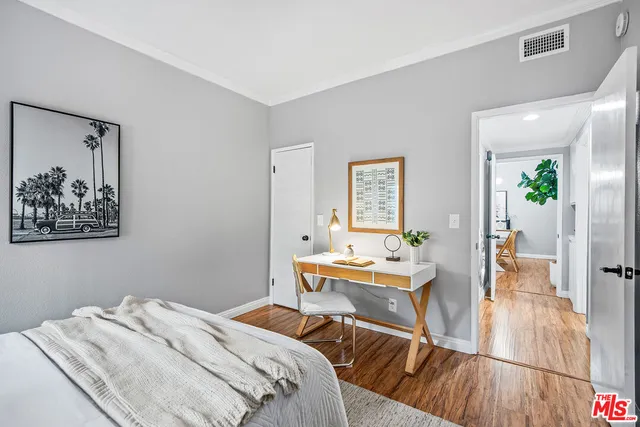 a bed room with a bed and a chair