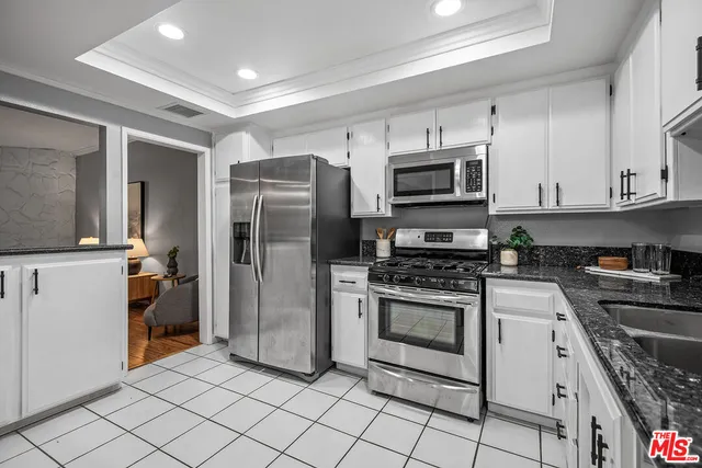 a kitchen with a stove microwave and refrigerator
