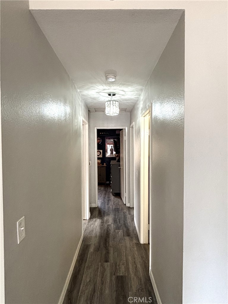 6845 Butte Drive Riverside, CA 92505 - Photo 12 of 27 a view of a hallway with wooden floor