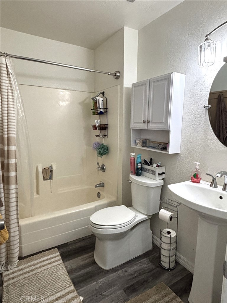 6845 Butte Drive Riverside, CA 92505 - Photo 13 of 27 a bathroom with a sink a toilet and shower