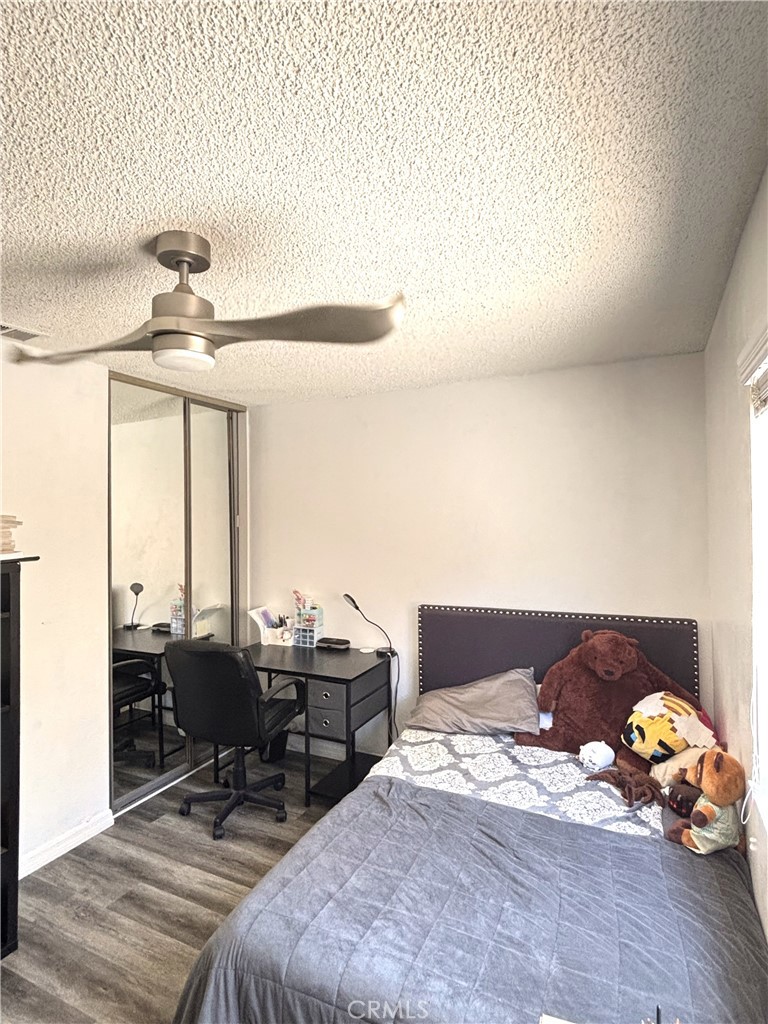 6845 Butte Drive Riverside, CA 92505 - Photo 15 of 27 a bedroom with bed and window