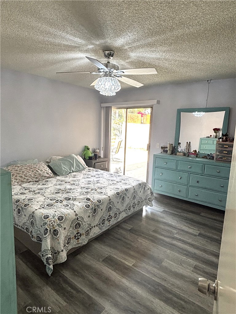 6845 Butte Drive Riverside, CA 92505 - Photo 18 of 27 a bedroom with a large bed and a window