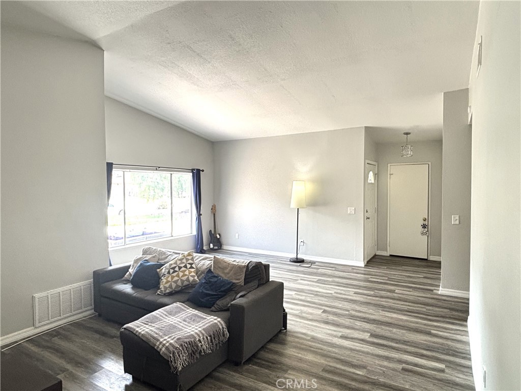6845 Butte Drive Riverside, CA 92505 - Photo 4 of 27 a living room with furniture and a window
