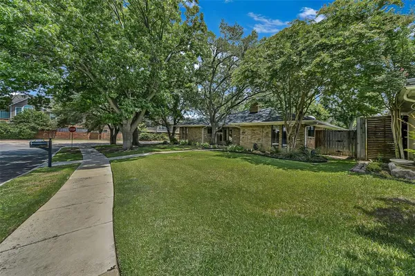 a house view with a garden space