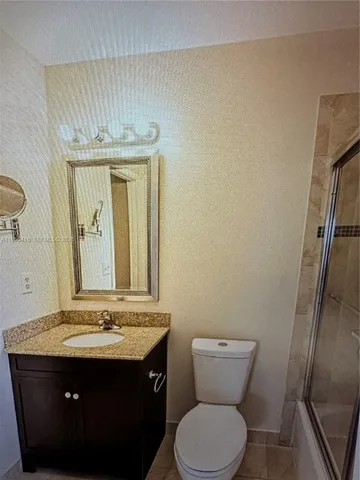 a view of a living room and floor to ceiling window