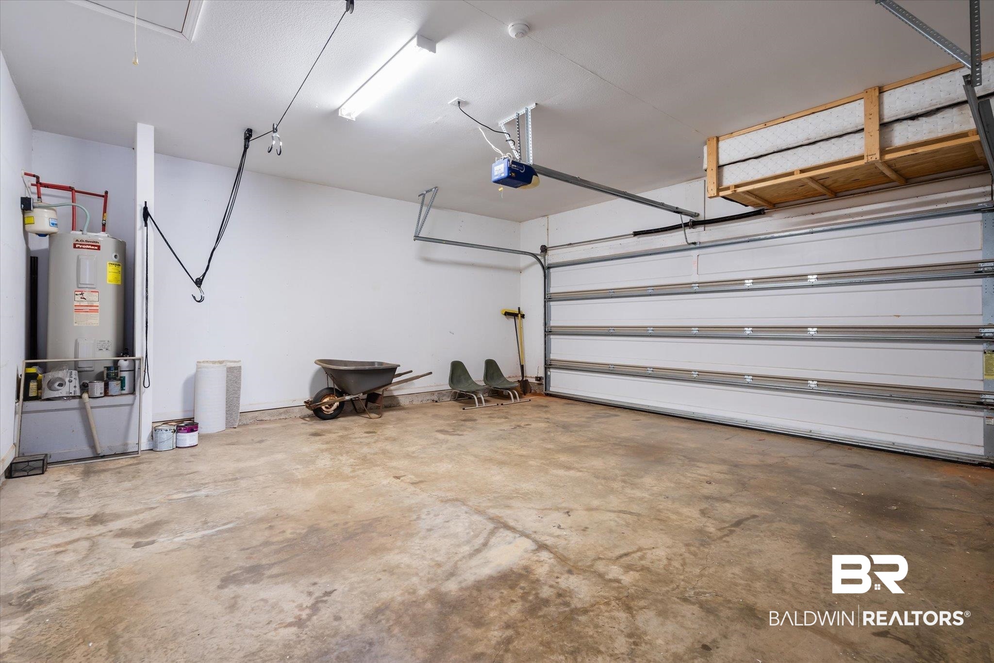10251 Fionn Loop Daphne, AL 36526 - Photo 25 of 28 Garage featuring electric water heater and a garage door opener