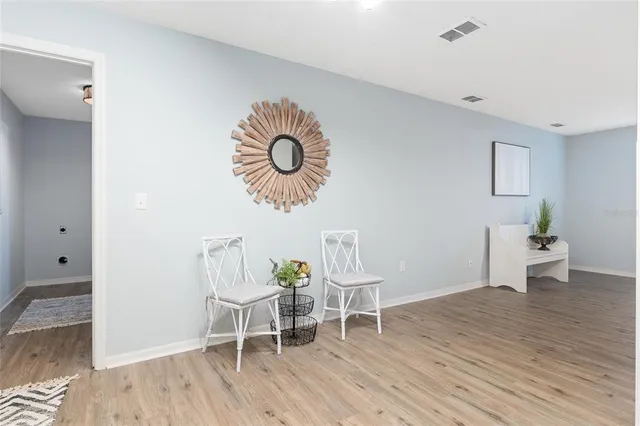 a view of a room with furniture and a floor to ceiling window