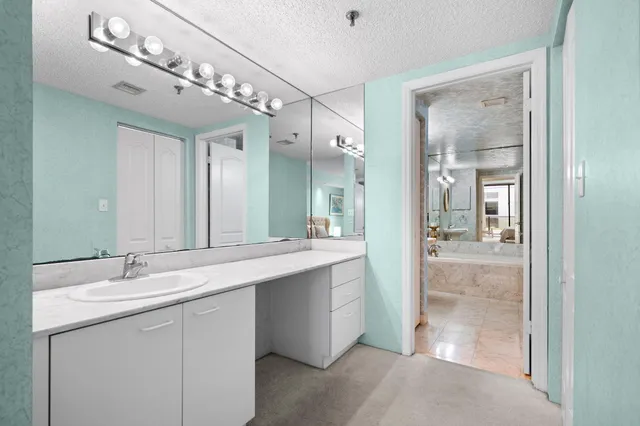 a bathroom with a double vanity sink mirror and double