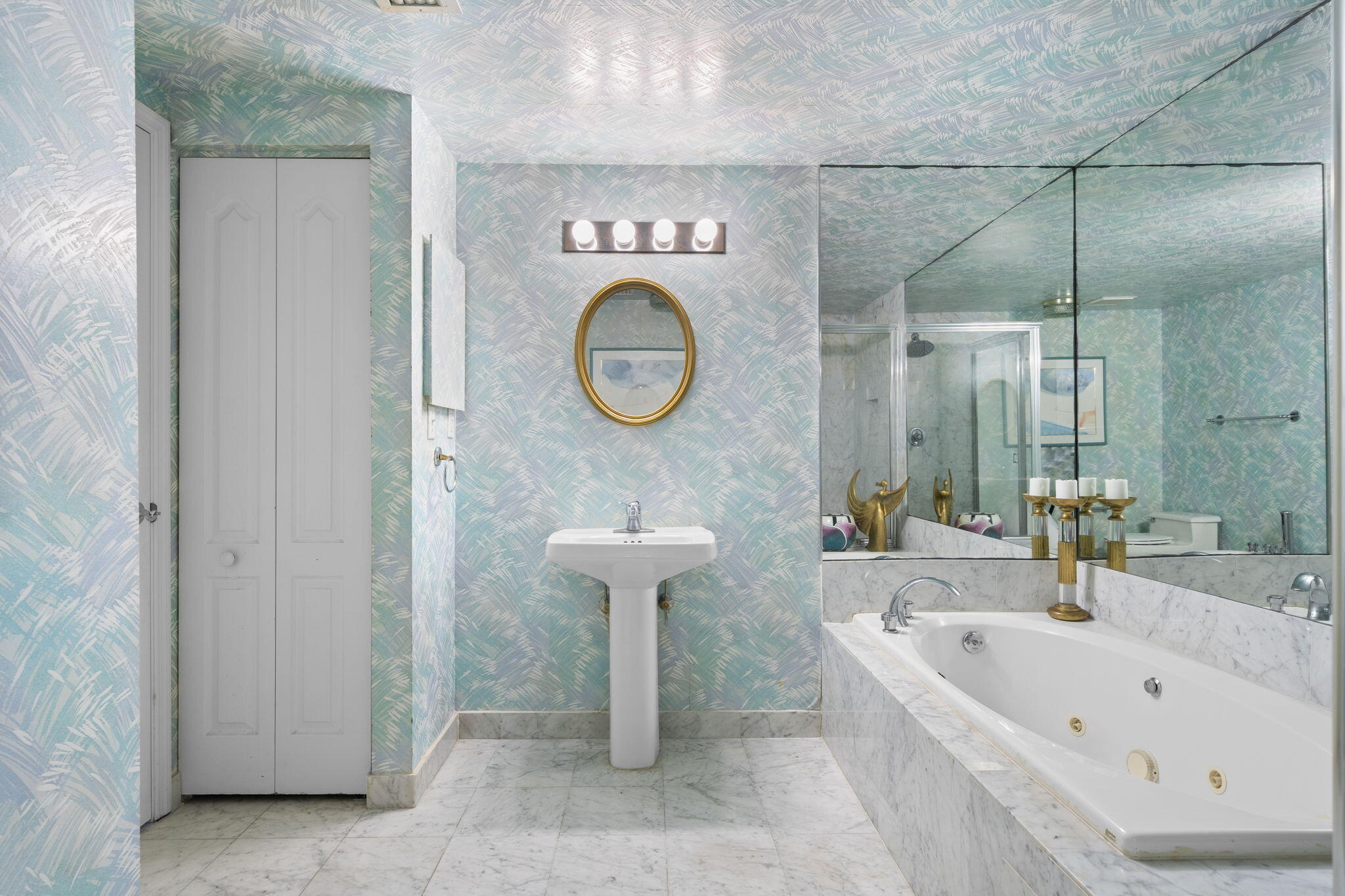 9455 Collins Avenue, Unit 305 Surfside, FL 33154 - Photo 16 of 58 a bathroom with a sink a toilet and a bathtub