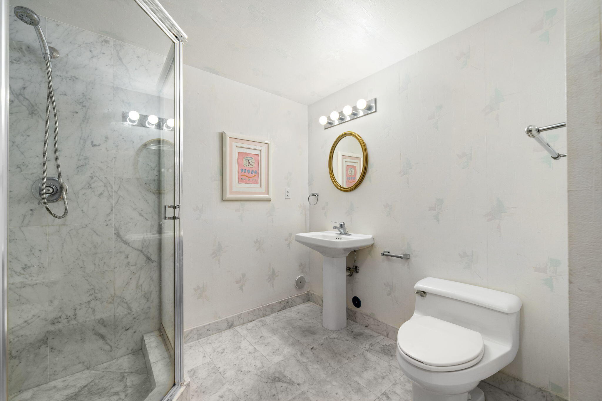 9455 Collins Avenue, Unit 305 Surfside, FL 33154 - Photo 25 of 58 a bathroom with a toilet sink and shower