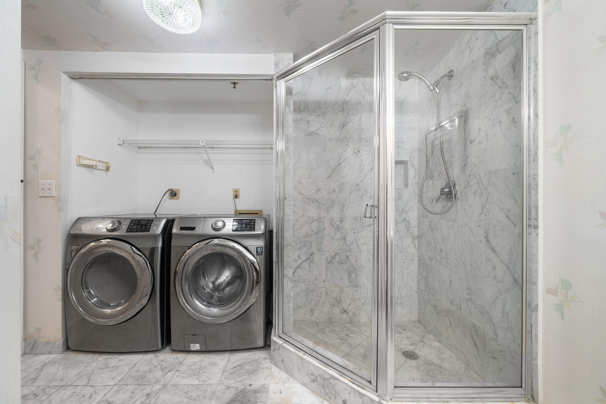 9455 Collins Avenue, Unit 305 Surfside, FL 33154 - Photo 26 of 58 a utility room with dryer and washer