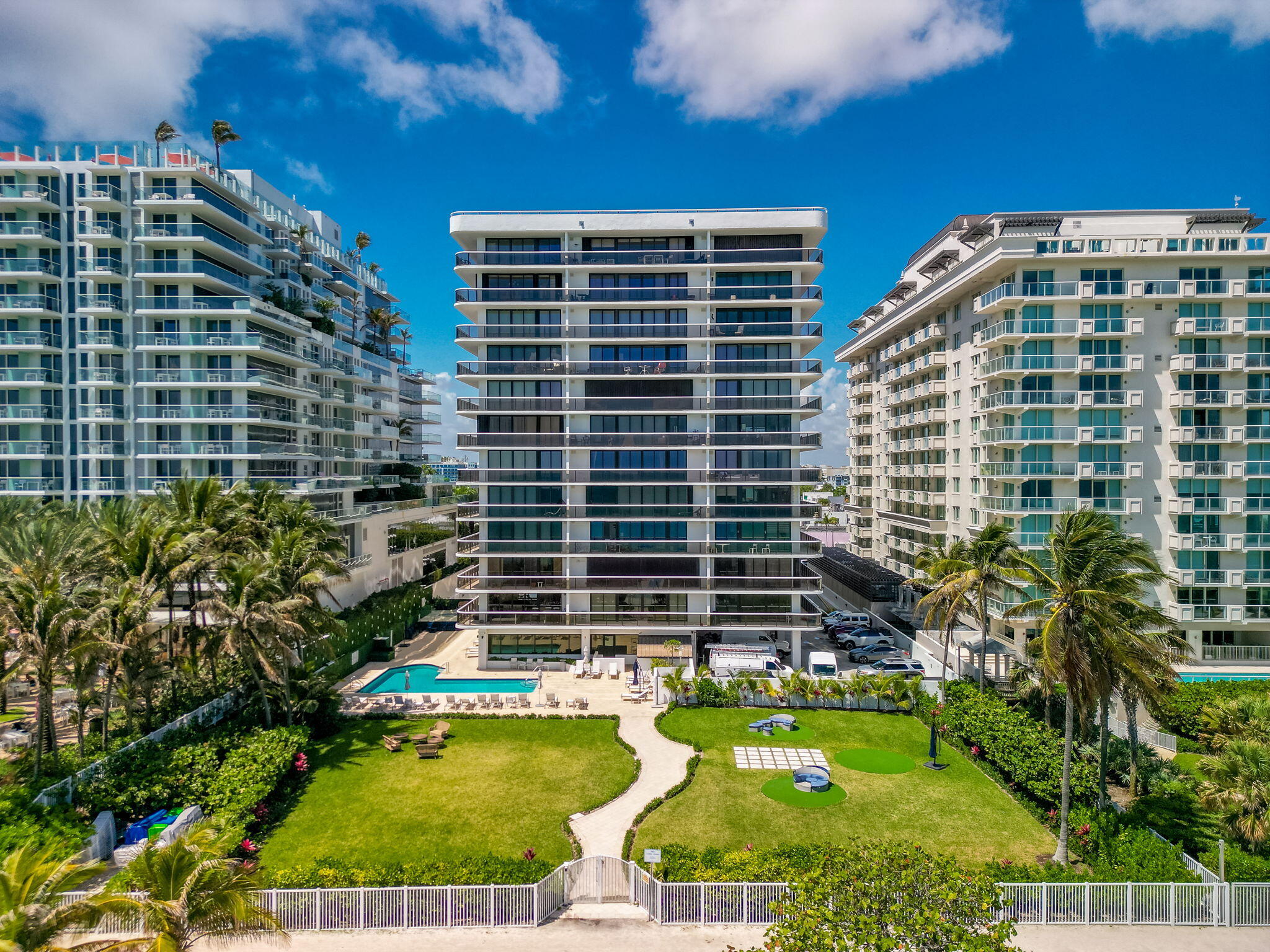 9455 Collins Avenue, Unit 305 Surfside, FL 33154 - Photo 42 of 58 a view of a swimming pool with a patio