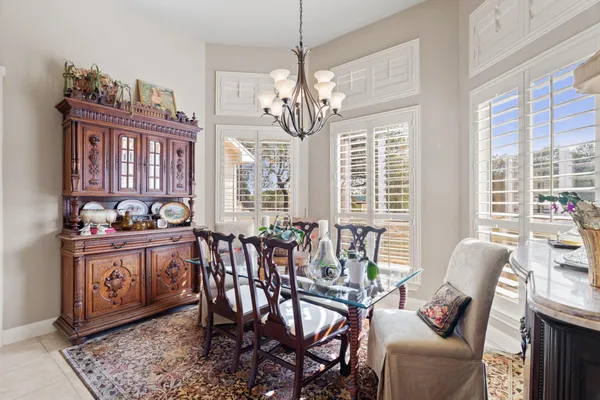 a view of a dining room with furniture window and outside view