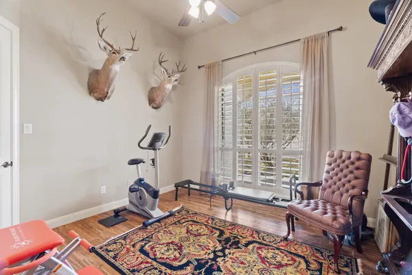 a bedroom with furniture and a window