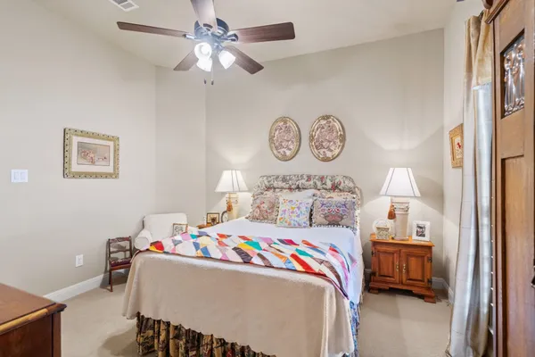 a bedroom with a bed and a table in it