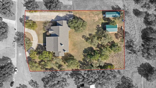 aerial view of a house with a yard