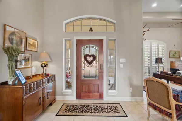 a view of an entryway with wooden floor