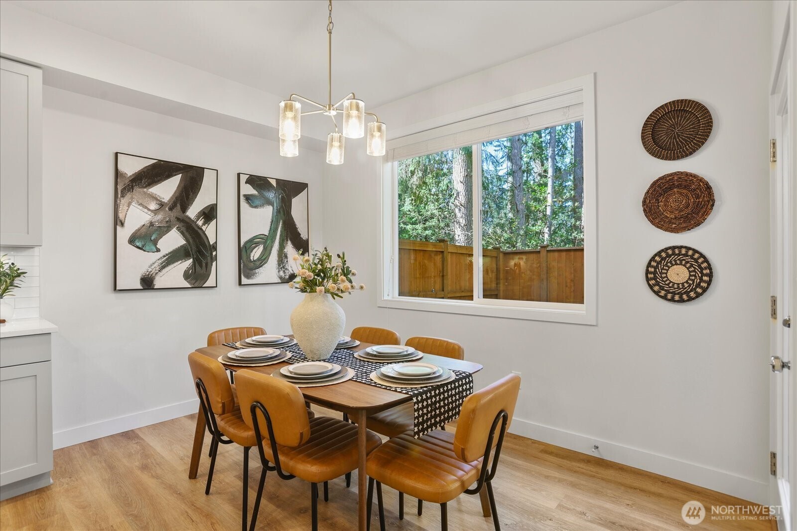 121 171st Place Southwest, Unit B Bothell, WA 98012 - Photo 13 of 36 a view of a dining room with furniture window and wooden floor