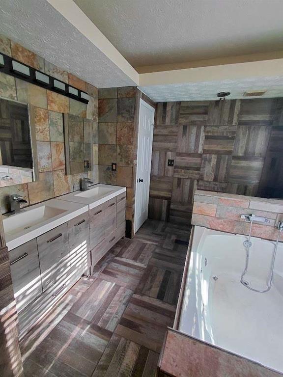 2291 Wilkins Court Decatur, GA 30035 - Photo 12 of 19 a bathroom with a double vanity sink a mirror and a shower