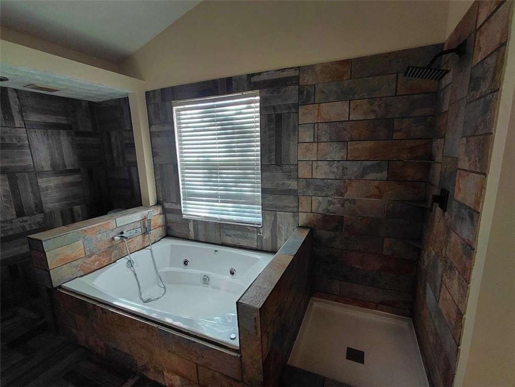 2291 Wilkins Court Decatur, GA 30035 - Photo 13 of 19 a bath tub sitting in a bathroom next to a sink