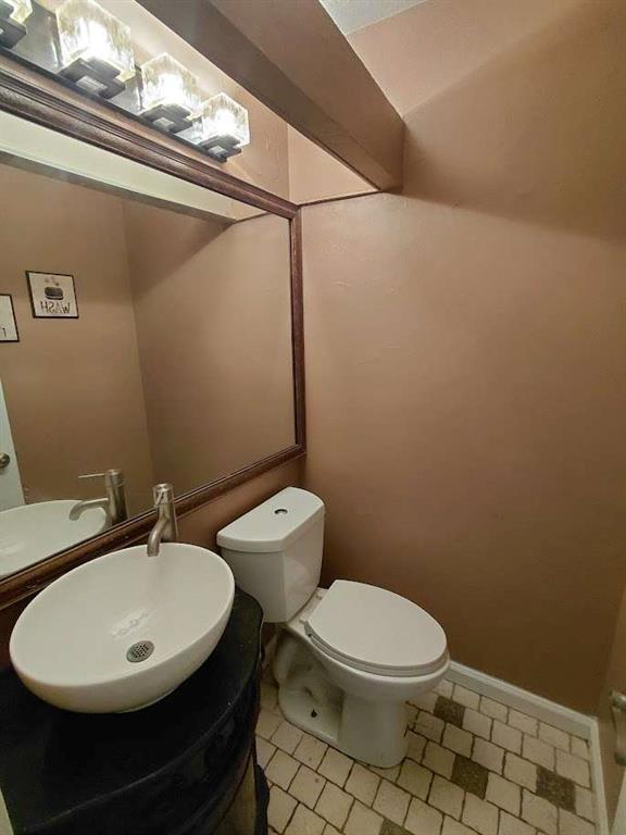 2291 Wilkins Court Decatur, GA 30035 - Photo 14 of 19 a white toilet sitting next to a bathroom sink