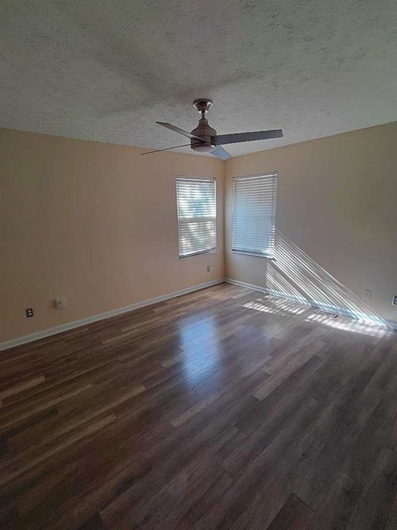 2291 Wilkins Court Decatur, GA 30035 - Photo 15 of 19 an empty room with wooden floor and windows