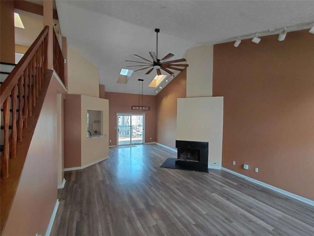 2291 Wilkins Court Decatur, GA 30035 - Photo 4 of 19 a view of a livingroom with wooden floor and a ceiling fan