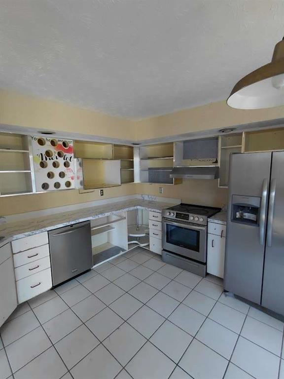 2291 Wilkins Court Decatur, GA 30035 - Photo 8 of 19 a kitchen with stainless steel appliances a stove sink and cabinets