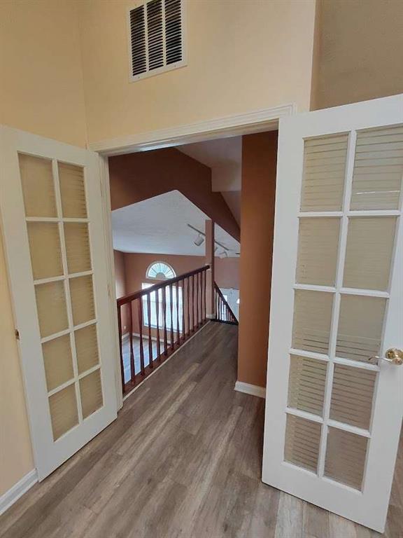 2291 Wilkins Court Decatur, GA 30035 - Photo 9 of 19 a view of an empty room with wooden floor and a window
