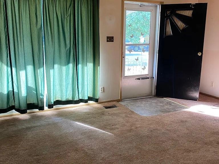 1940 South Richmond Road Decatur, IL 62521 - Photo 6 of 6 a view of an empty room with a window